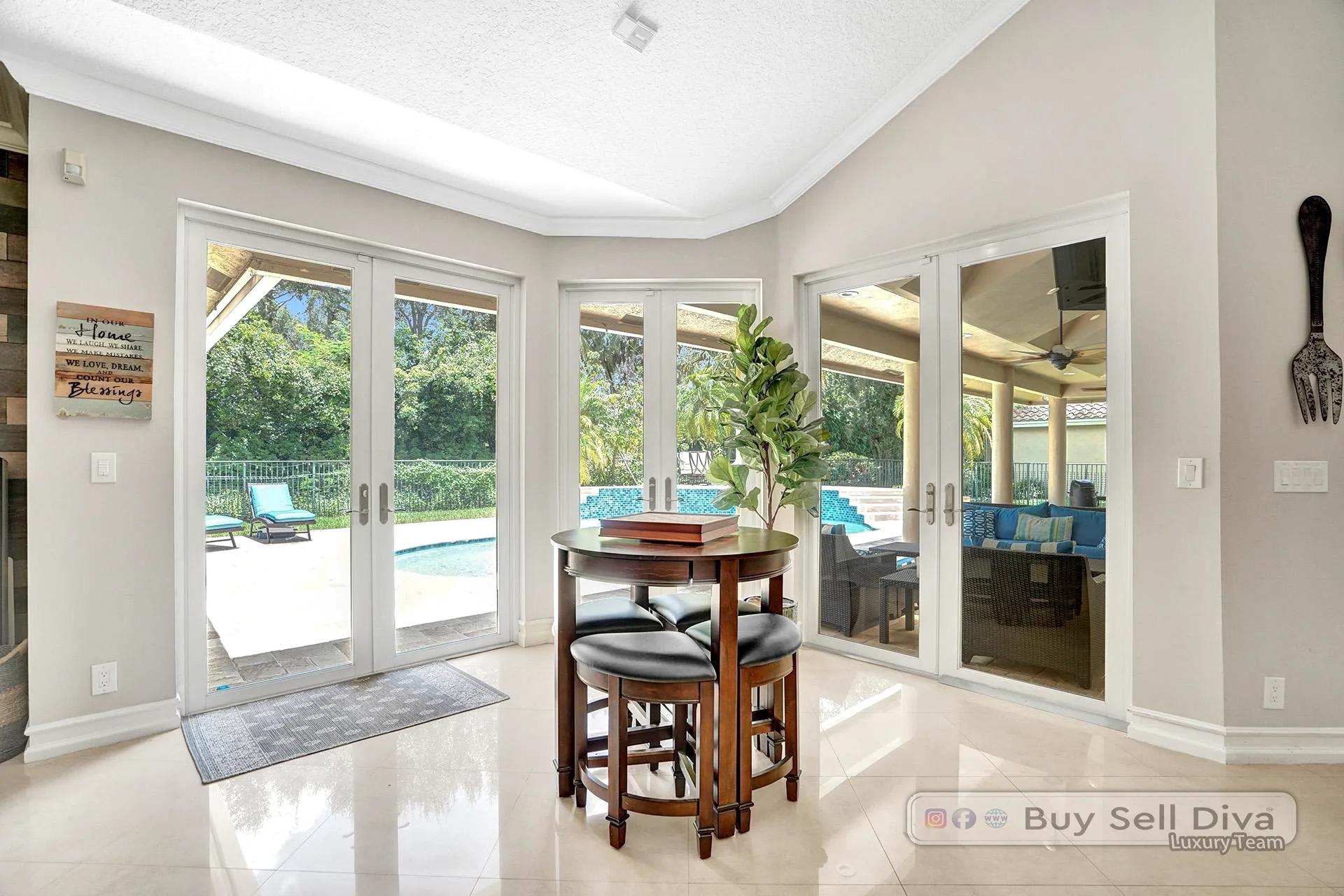 Breakfast area with French doors looking out to the covered patio and pool in Weston Florida.