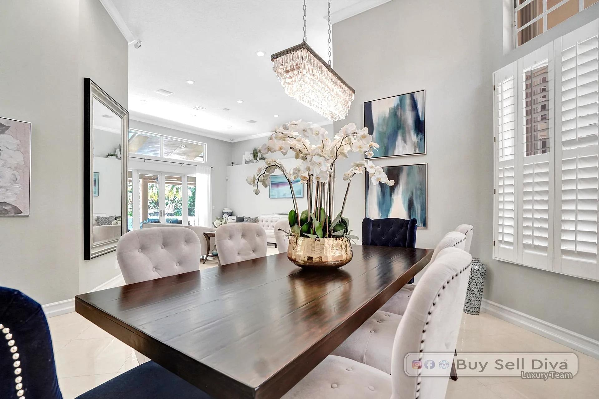 Dining table styling detail with plantation shutters in a Weston Florida home.
