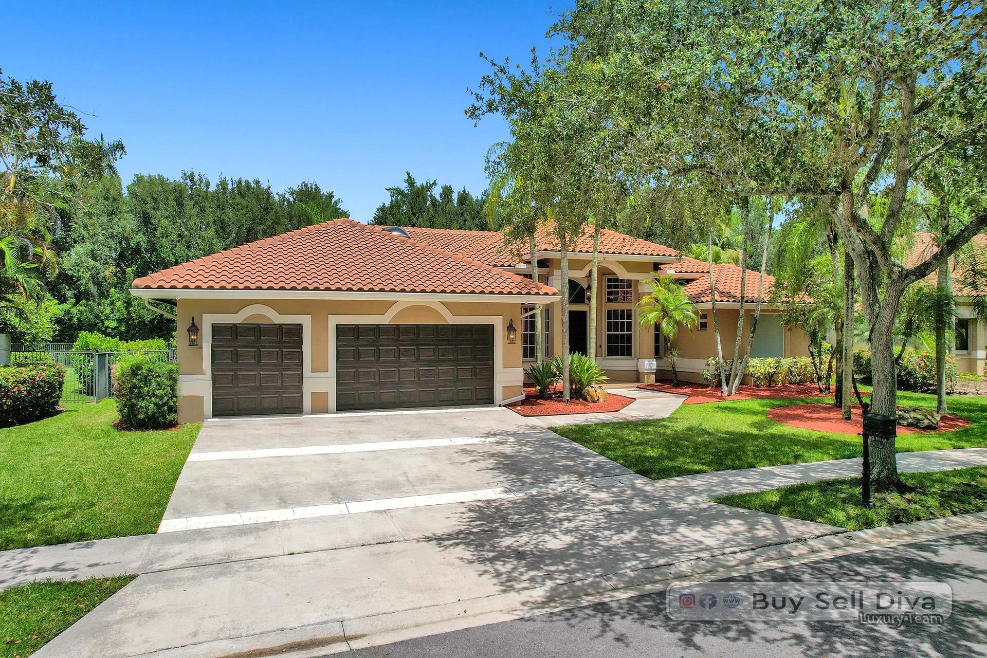 Curb view of a tile-roof ranch home on a landscaped lot in Weston Florida.