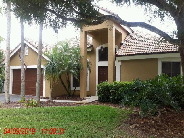 Lakefront pool home for sale in Parkland Florida: 7565 NW 75th Drive in guard-gated Whittier Oaks