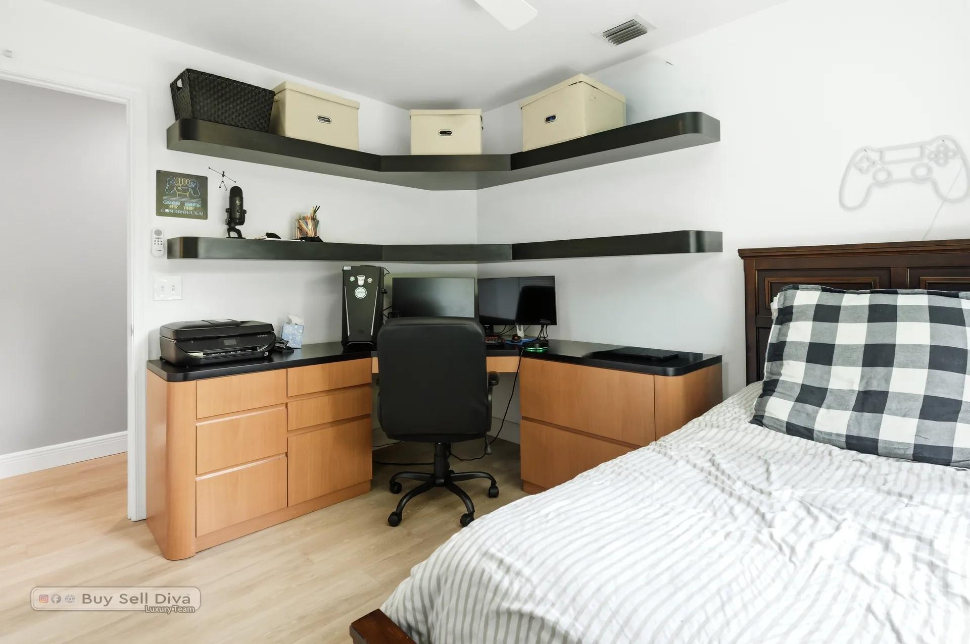Bedroom with custom corner desk and floating shelves