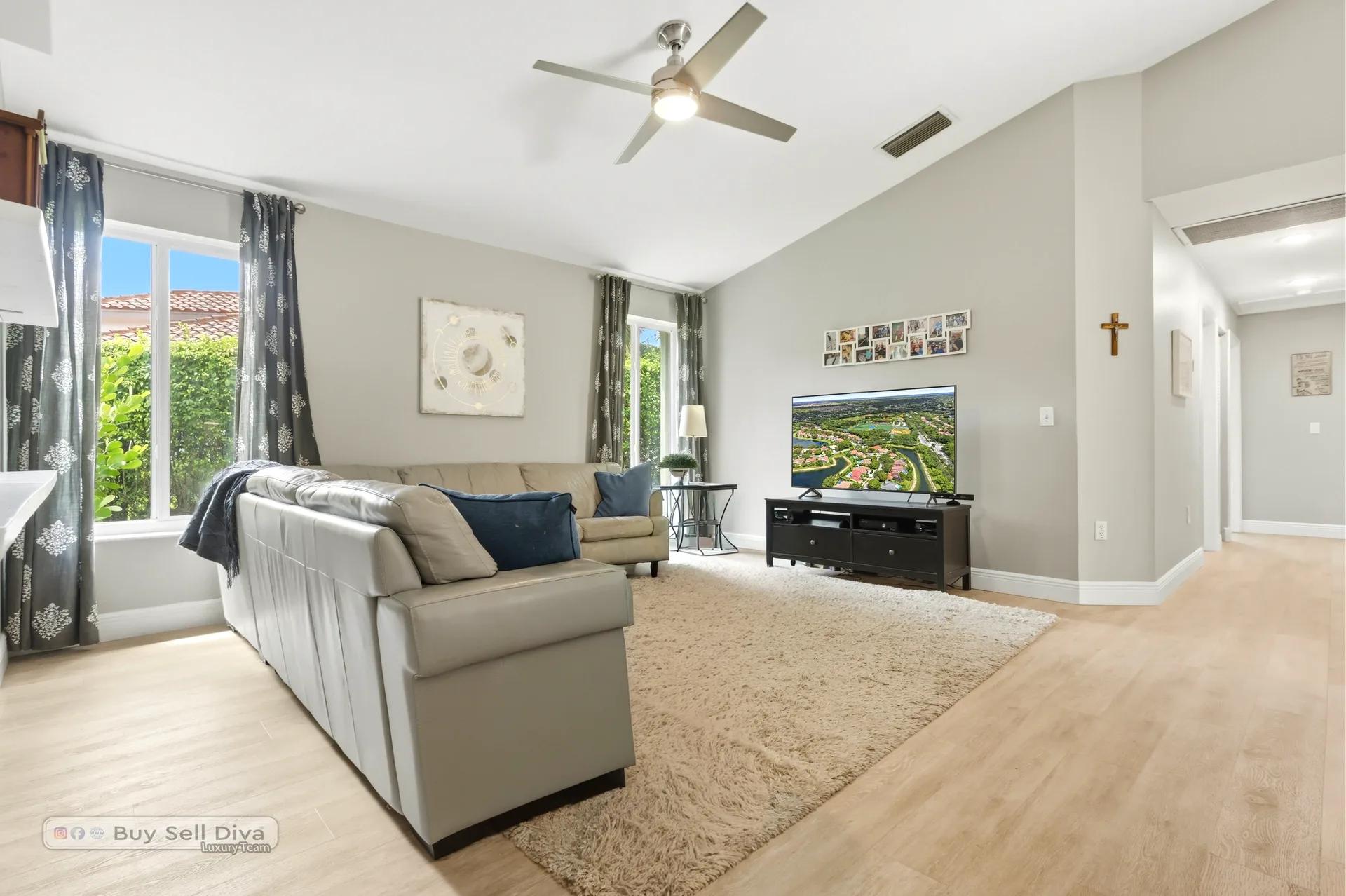 Family room with media wall and natural light from dual windows