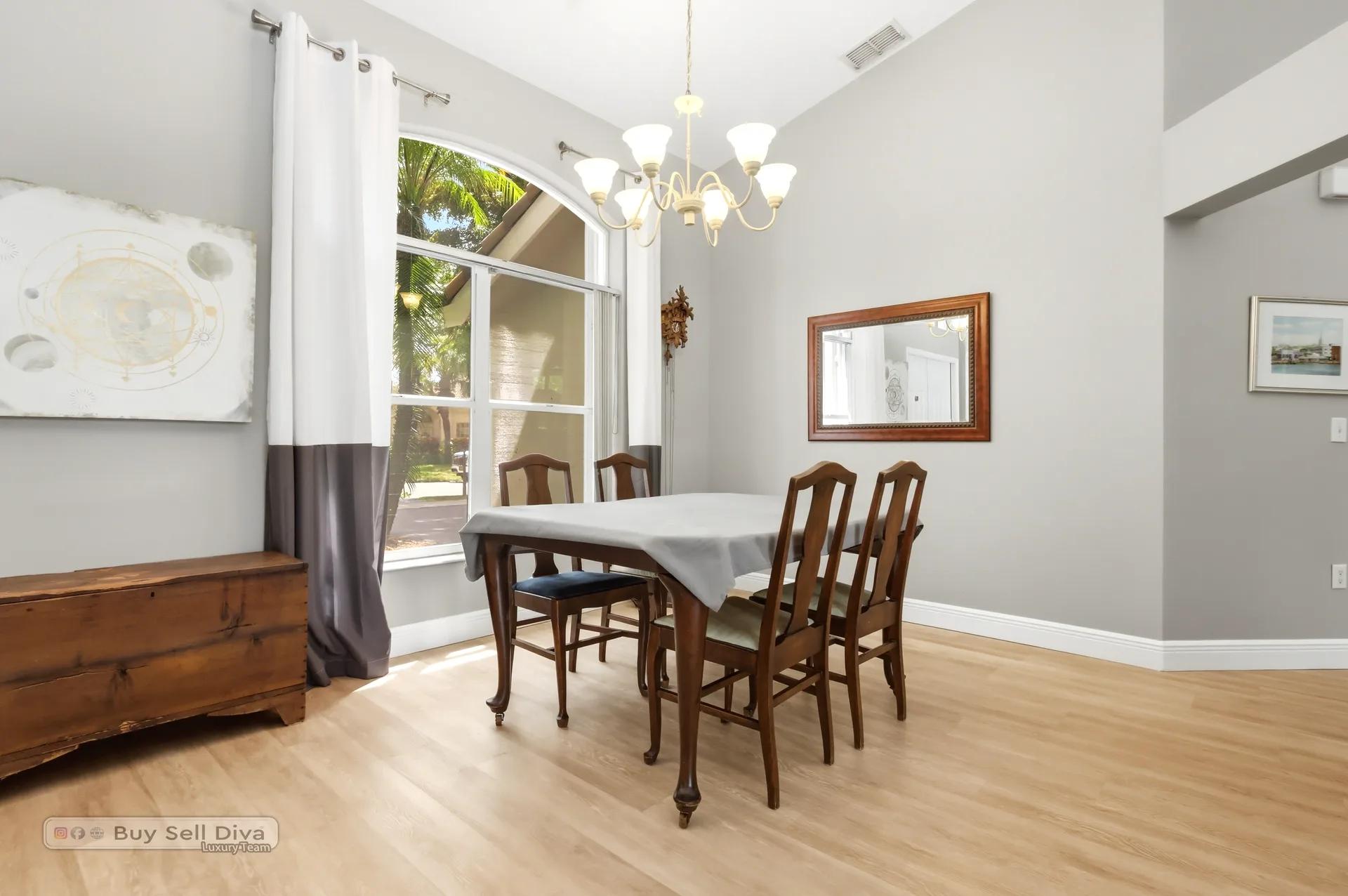 Dining room with natural light from the arched front window