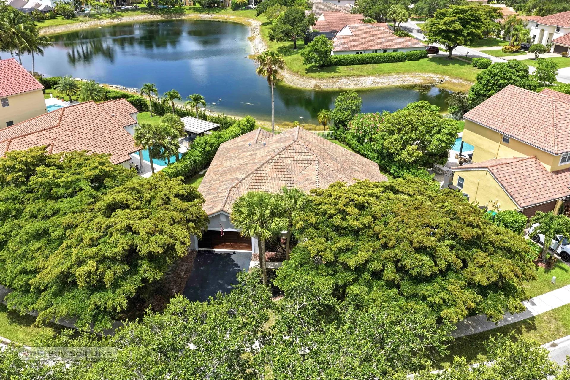 Aerial view of 7565 NW 75th Drive showing the lakefront lot