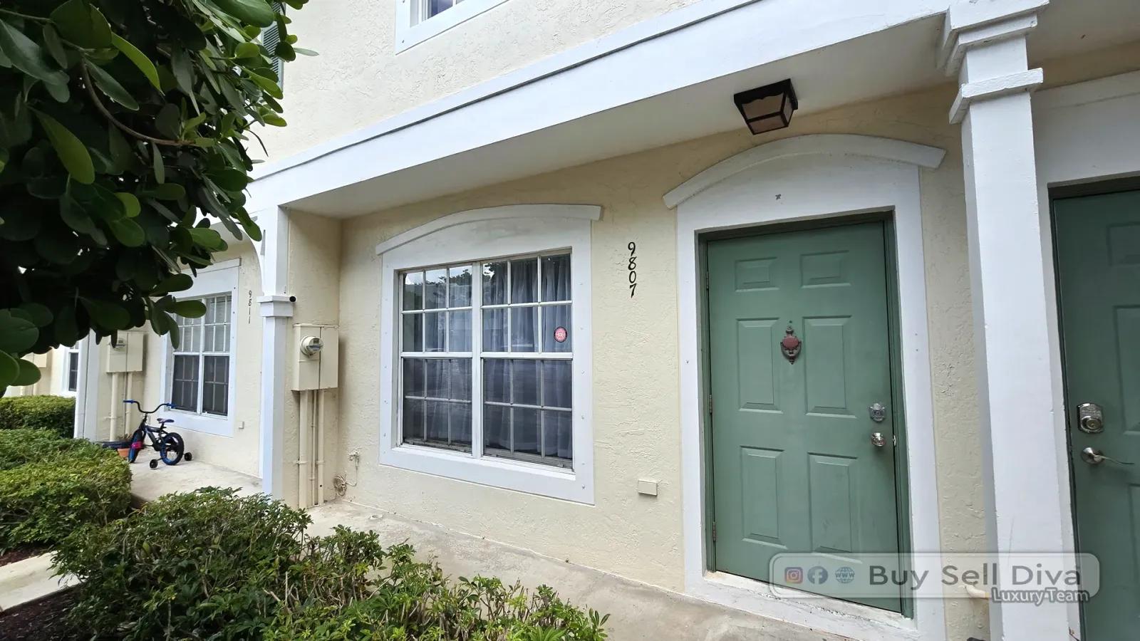 Front door of the townhome for sale at 9807 NW 57th Manor in Coral Reef Club, Coral Springs Florida
