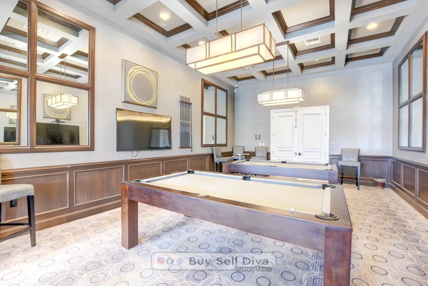 Billiards game room with coffered ceilings inside Club MiraLago in Parkland Florida