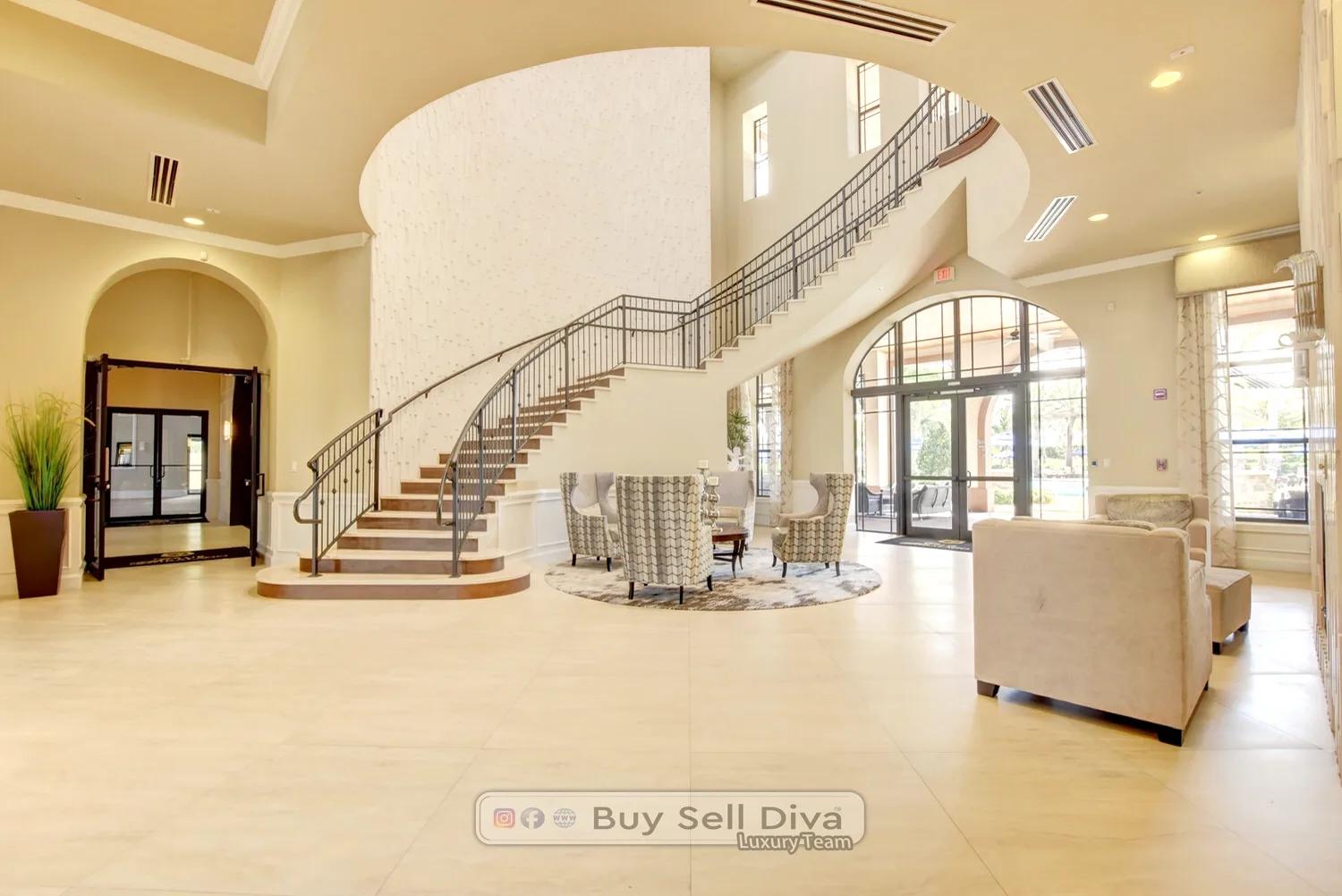 Grand lobby with curved staircase inside the MiraLago clubhouse in Parkland Florida
