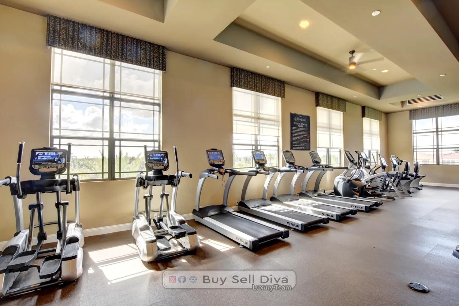 Fitness center with treadmills and cardio machines inside the MiraLago clubhouse in Parkland Florida