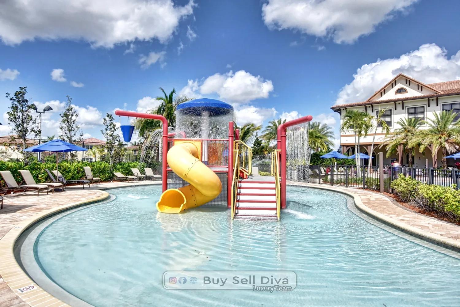 Kids splash zone with waterslide and dumping bucket at the MiraLago clubhouse pool in Parkland Florida