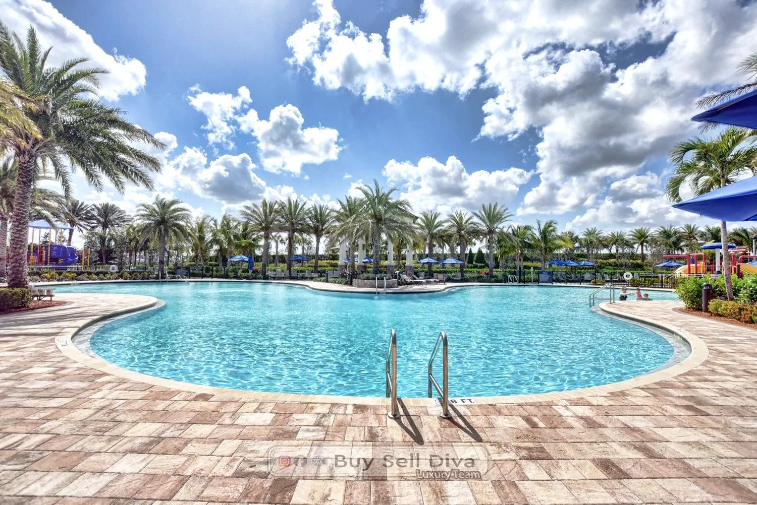 Zero-entry resort pool at Club MiraLago in Parkland Florida lined with palm trees