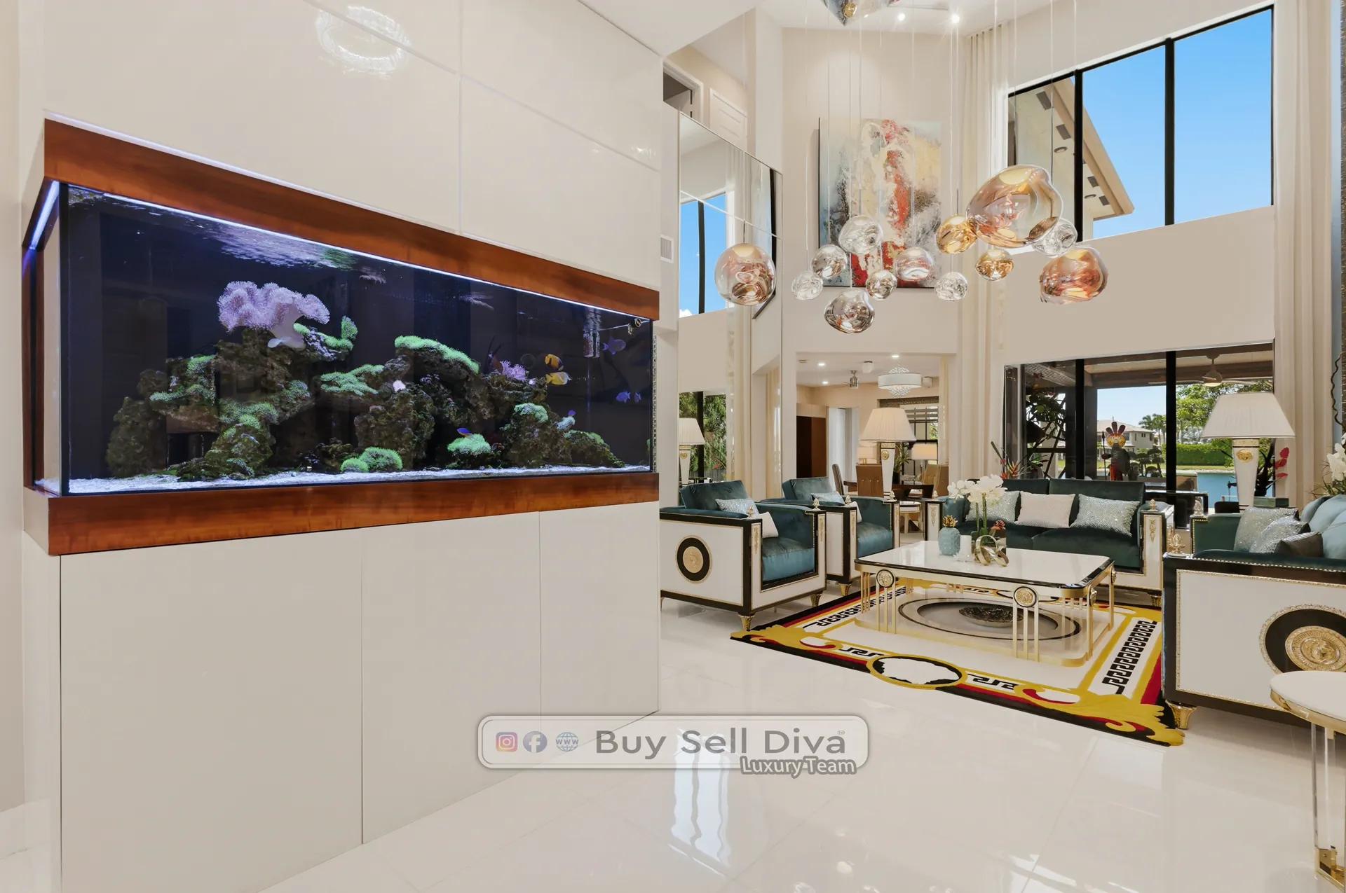 Parkland FL estate home: wall-mounted saltwater reef aquarium in two-story formal living room