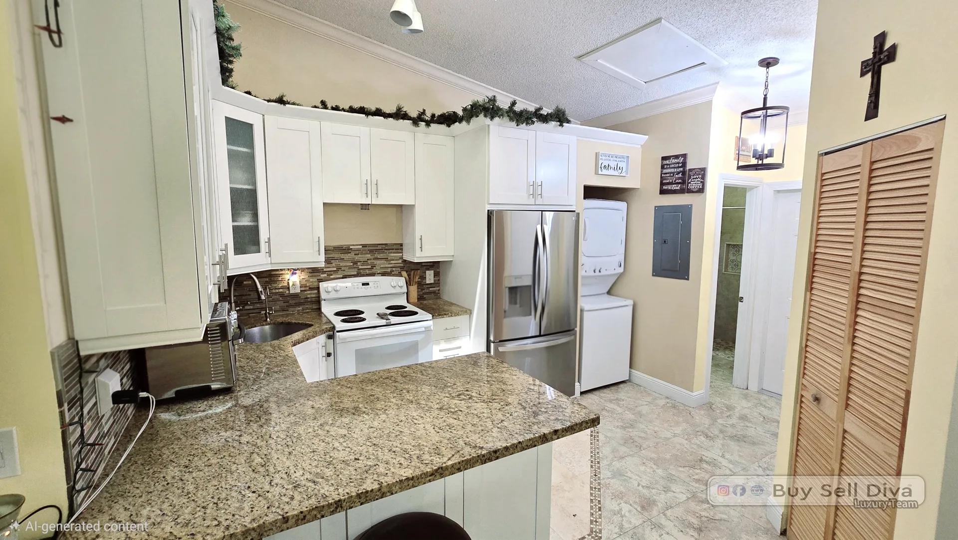 Remodeled kitchen with white shaker cabinets, granite counters, and stainless steel appliances in a Deerfield Beach townhouse for rent